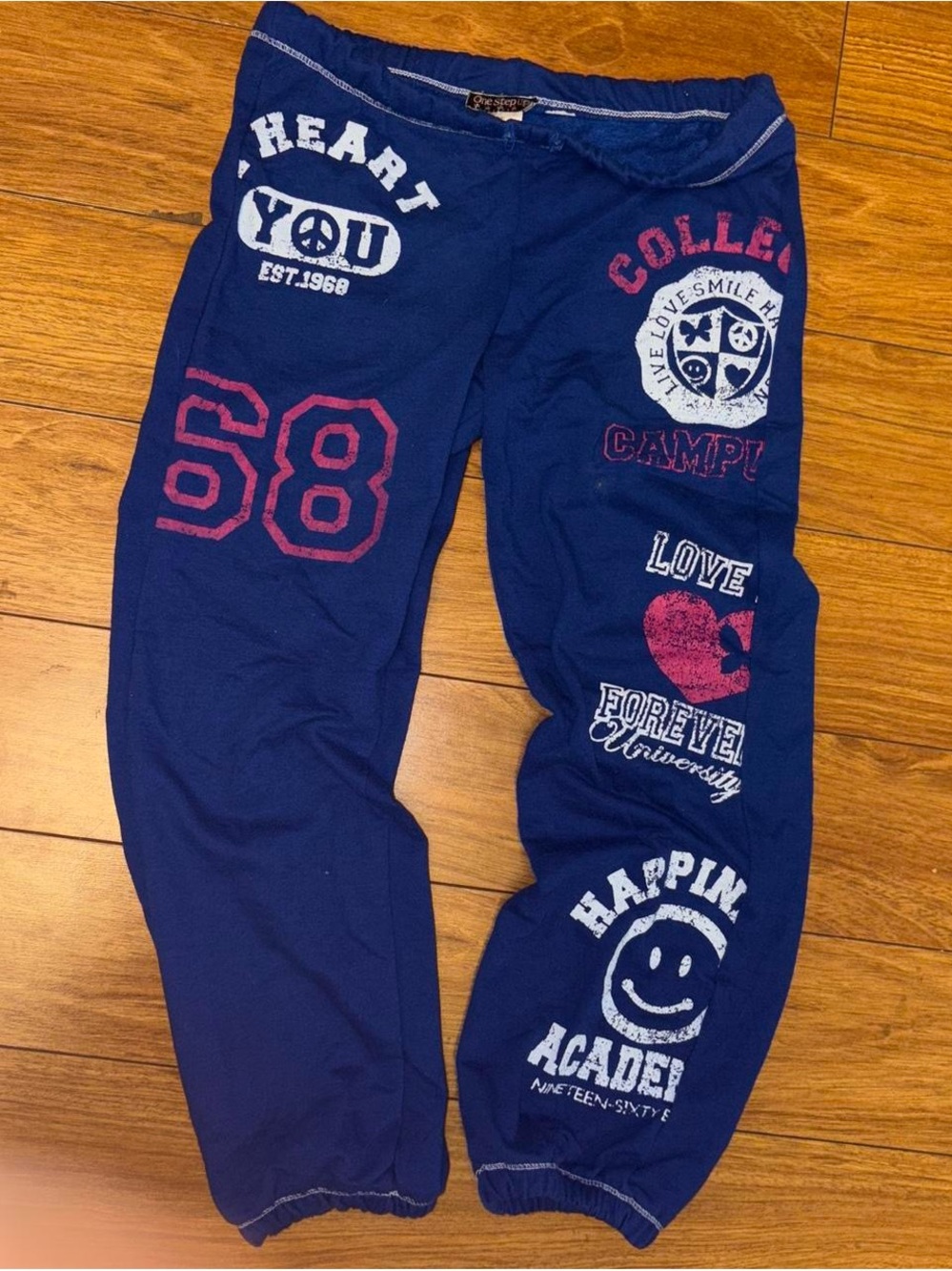 Y2K sweatpants with peace signs and hearts